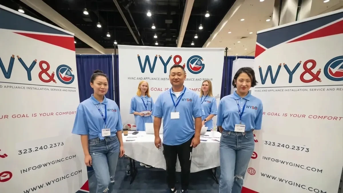 Alex, owner of WY&G (center), with the team at the company booth