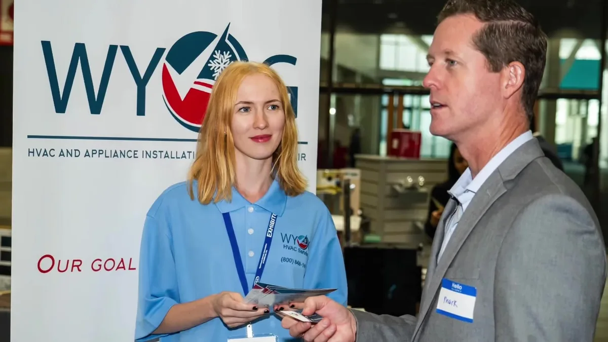 WY&G team member talking with a visitor