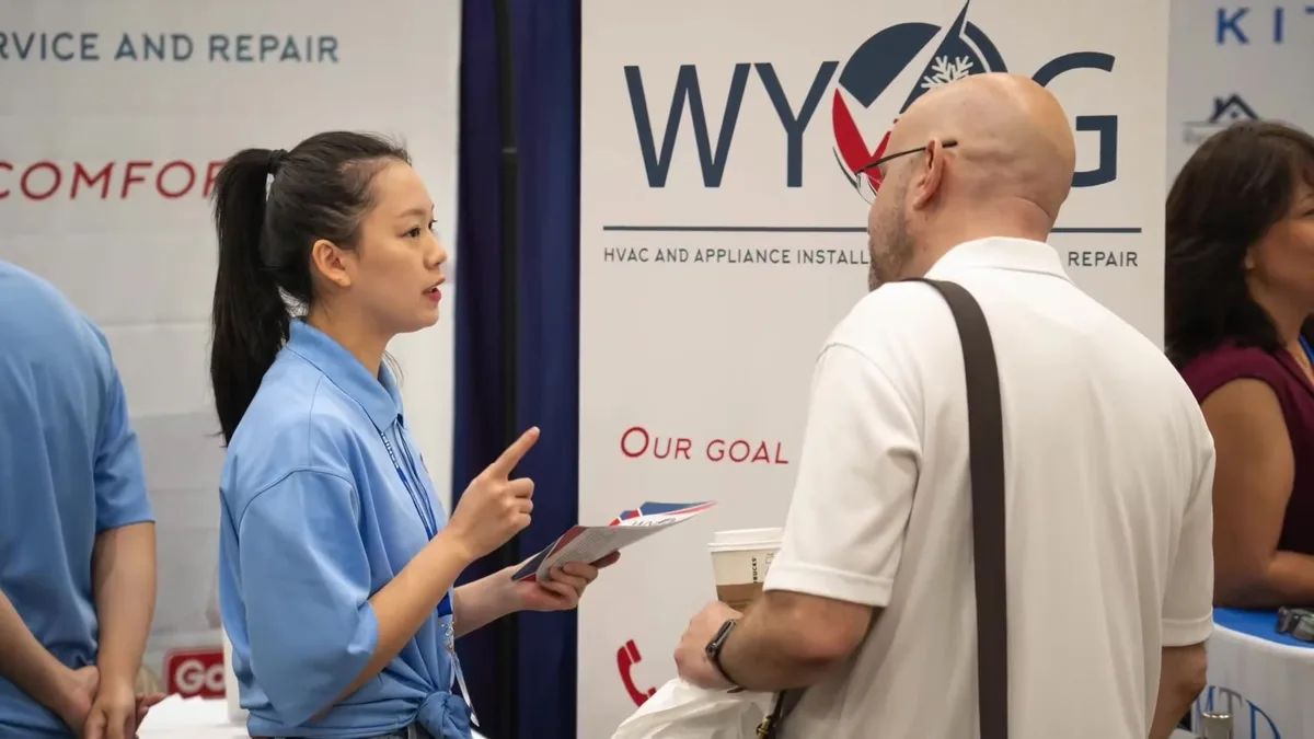 WY&G team member at the booth