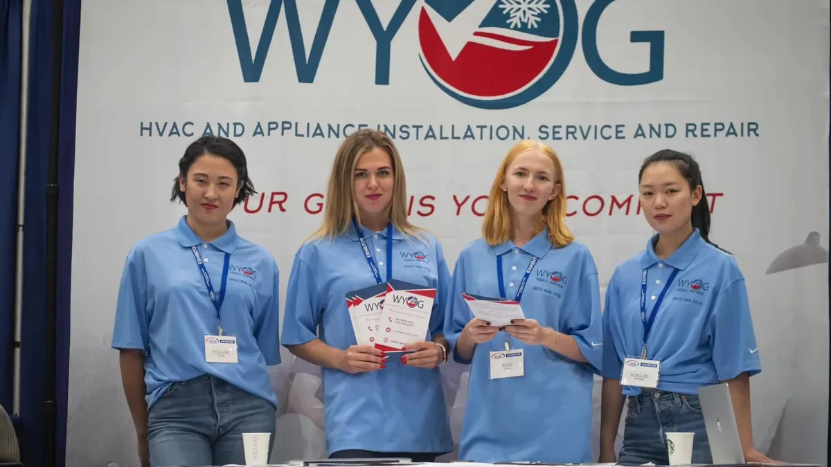 WY&G team members with brochures